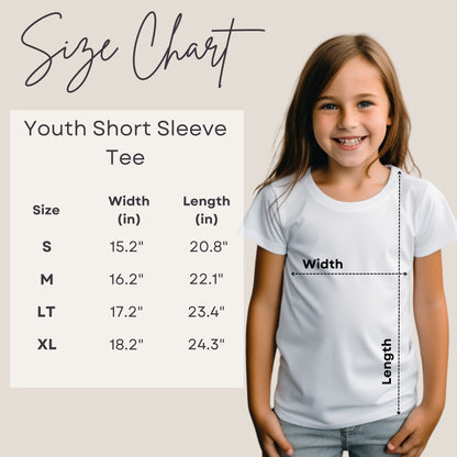 a little girl wearing a white shirt with a size chart