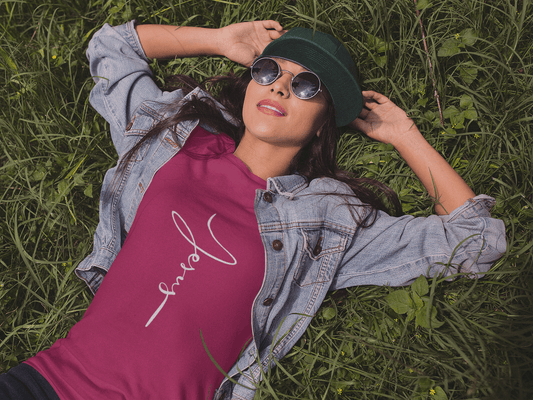 Jesus Cross Christian T-Shirt - Cursive White Font Bright Color Tees - Berry on cool girl lying in grass