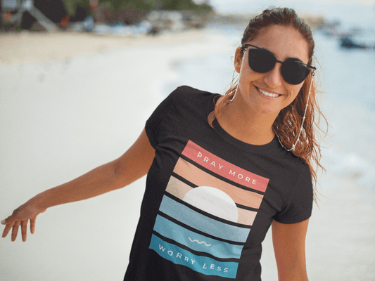 Pray More Worry Less T-Shirt - Sunset Graphic Christian Tee happy woman on a beach in sunglasses