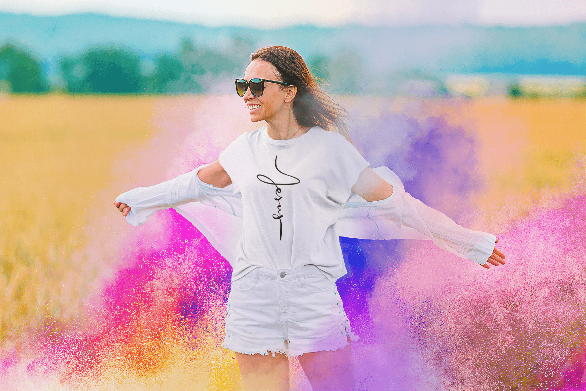 jesus cursive cross t-shirt in white on a happy woman